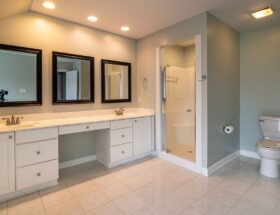 Spacious contemporary bathroom with dual sinks and a shower panel.