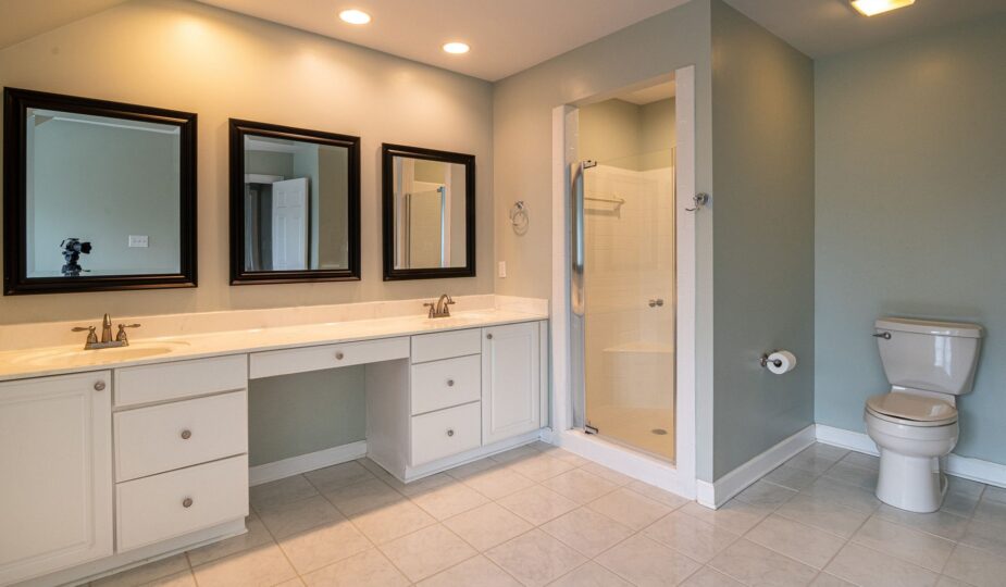 Spacious contemporary bathroom with dual sinks and a shower panel.