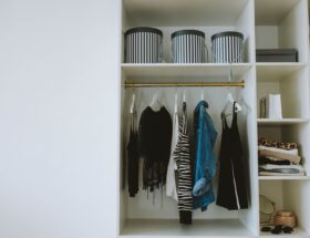 Organized wardrobe with trendy clothes, hangers, and storage boxes.
